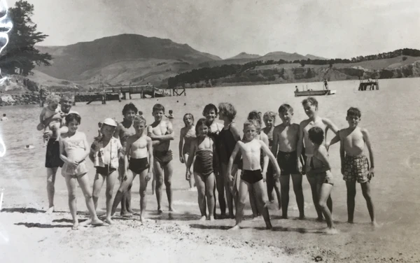 Black and white photograph of children on Corsair bay in Lyttelton Harbour