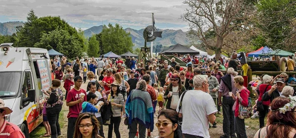 crowds of people walking through Orton Bradley Park